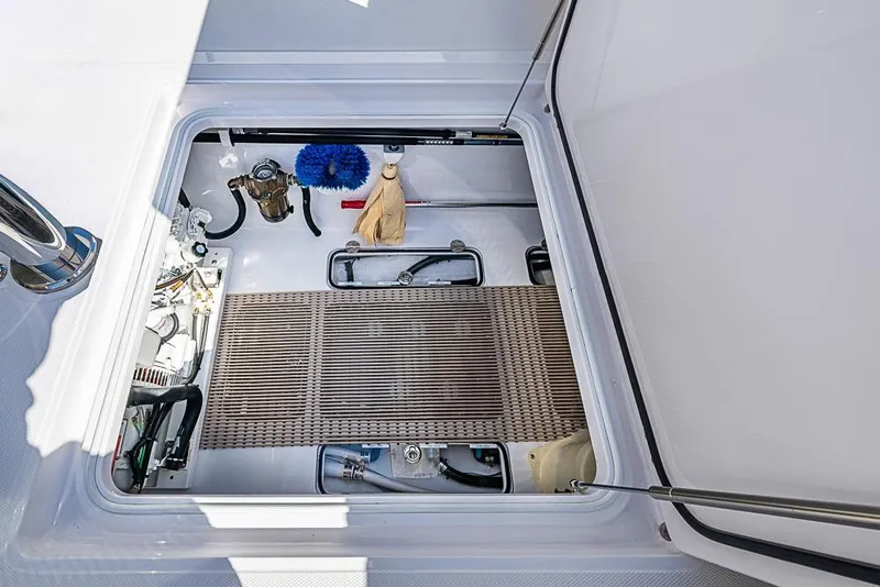 Slide: The Image of Open hatch of 2025 Sparks 46 boat showing storage and equipment. - 91