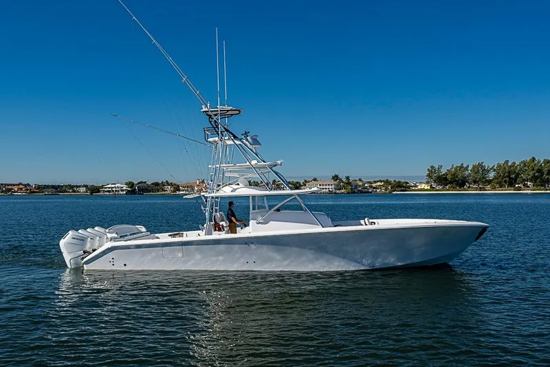 Slide: The Image of A sleek 2025 Sparks 46 yacht cruising on a calm, sunny day. - 97