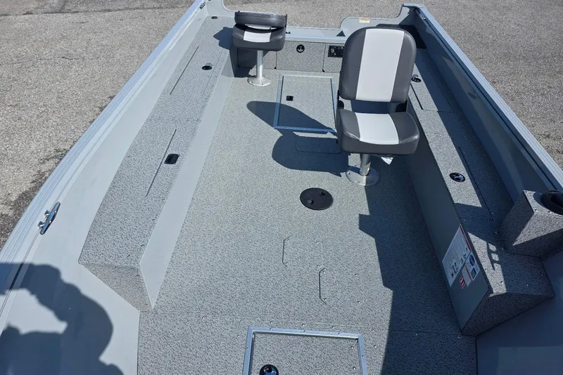 Slide: The Image of 2026 Smoker Craft Freedom 160 TL boat interior with seating and storage compartments. - 12