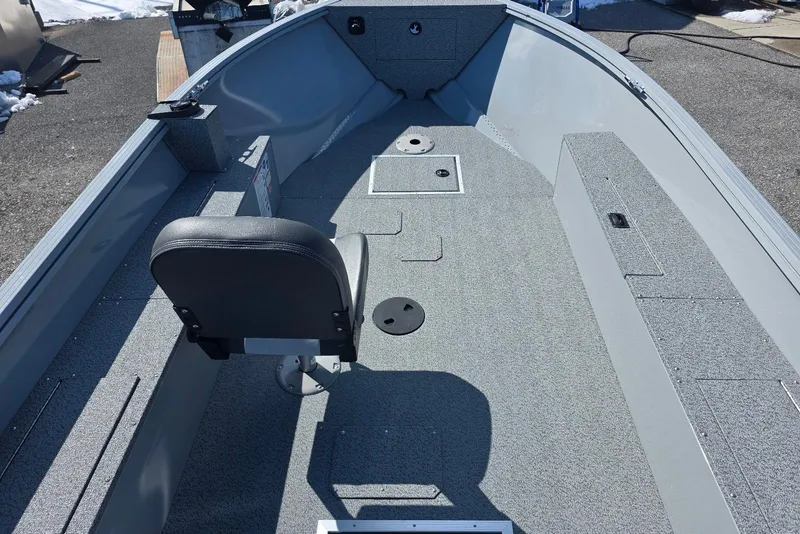 Slide: The Image of 2026 Smoker Craft Freedom 160 TL boat interior with seating and storage compartments. - 7