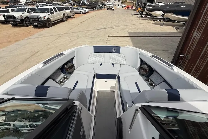 Slide: The Image of 2024 MasterCraft X24 boat interior with luxurious seating and modern design. - 10