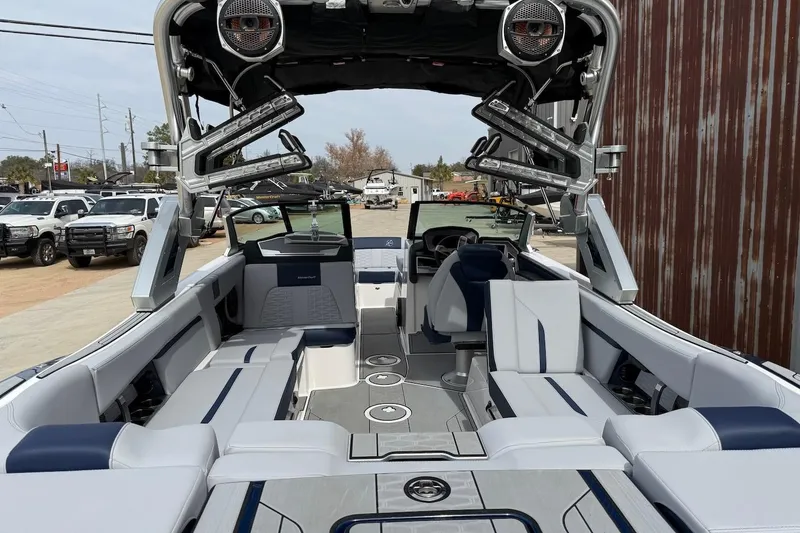 Slide: The Image of 2024 MasterCraft X24 boat interior with luxurious seating and advanced audio system. - 5