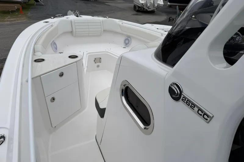 Slide: The Image of 2024 Edgewater 262CC boat interior with seating and storage compartments. - 25