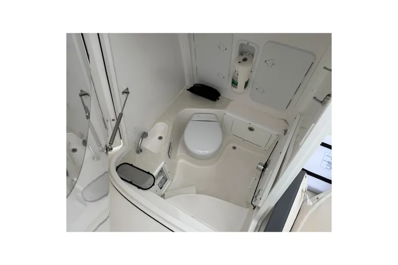 Slide: The Image of 2024 Edgewater 262CC boat interior with compact bathroom amenities. - 31