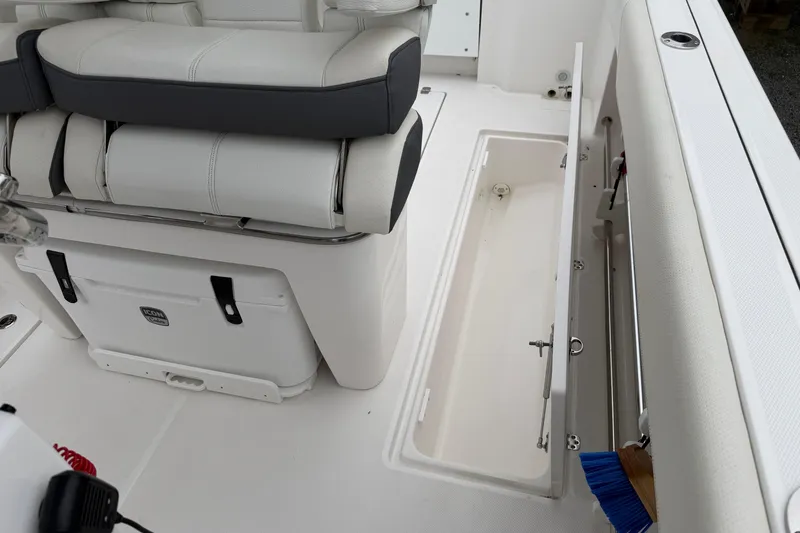 Slide: The Image of 2024 Edgewater 262CC boat interior with seating and storage compartment. - 33