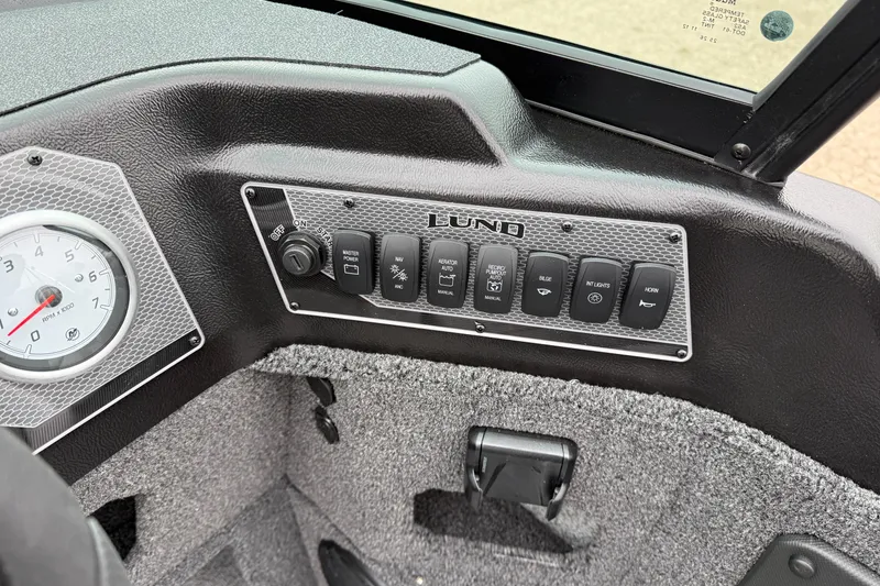 Slide: The Image of Dashboard of 2026 Lund 1875 Impact XS Sport boat with control panel and gauge. - 23
