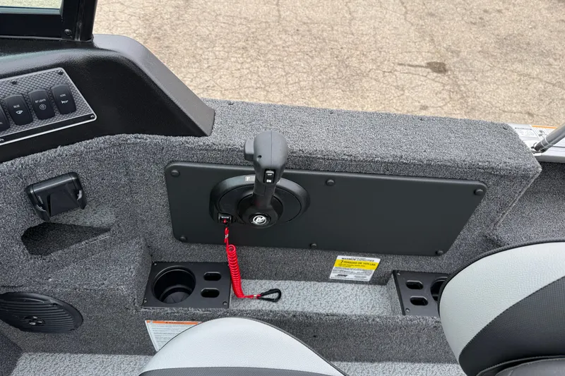 Slide: The Image of Interior of 2026 Lund 1875 Impact XS Sport boat, featuring control panel and seating. - 24