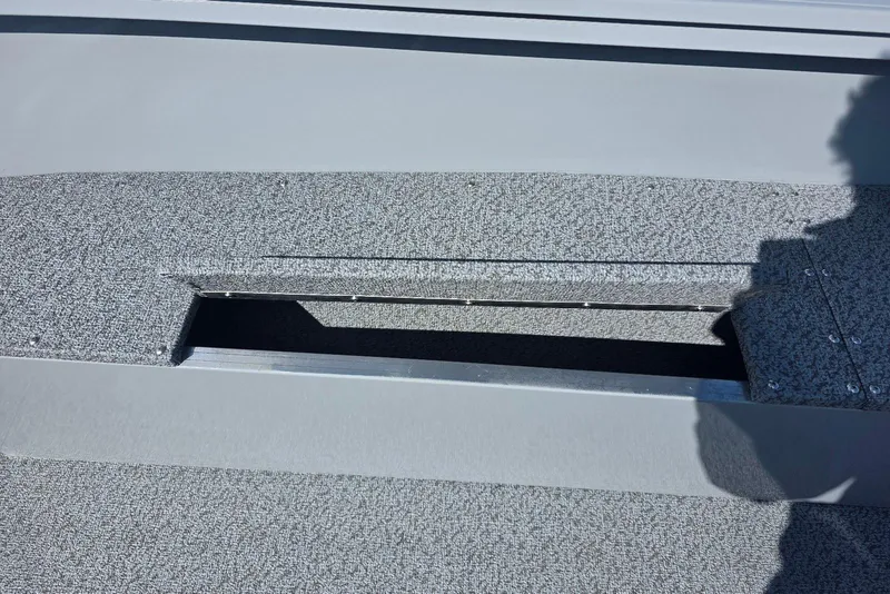 Slide: The Image of 2026 Smoker Craft Freedom 160 TL boat interior with open storage compartment. - 19