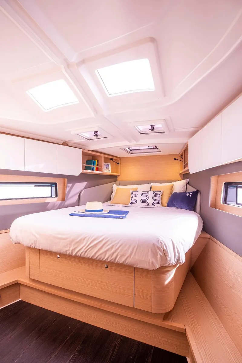 Slide: The Image of Luxurious bedroom in 2024 Dufour 41 yacht with skylights and modern decor. - 7