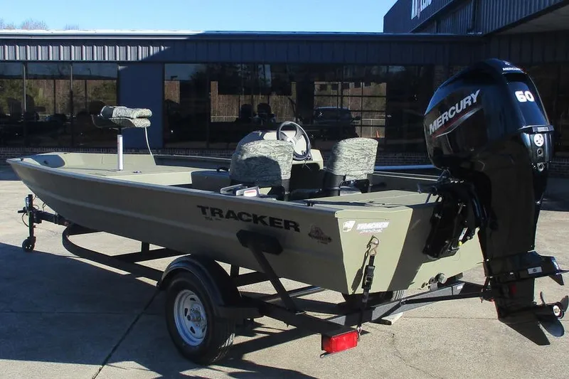 Slide: The Image of 2026 Tracker Grizzly 1754 SC boat with Mercury 60 engine on trailer. - 3