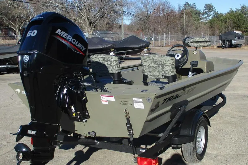 Slide: The Image of 2026 Tracker Grizzly 1754 SC boat with Mercury engine on trailer. - 4