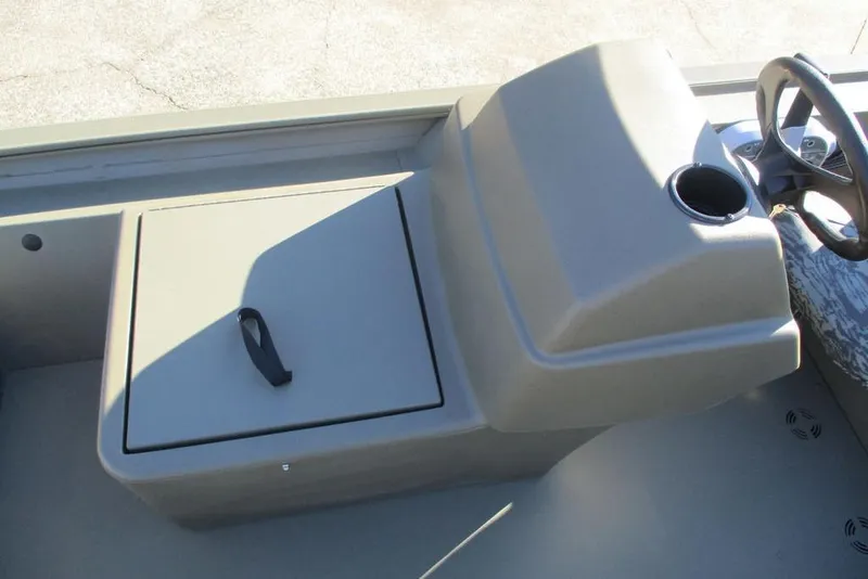 Slide: The Image of 2026 Tracker Grizzly 1754 SC boat console with storage compartment and steering wheel. - 8