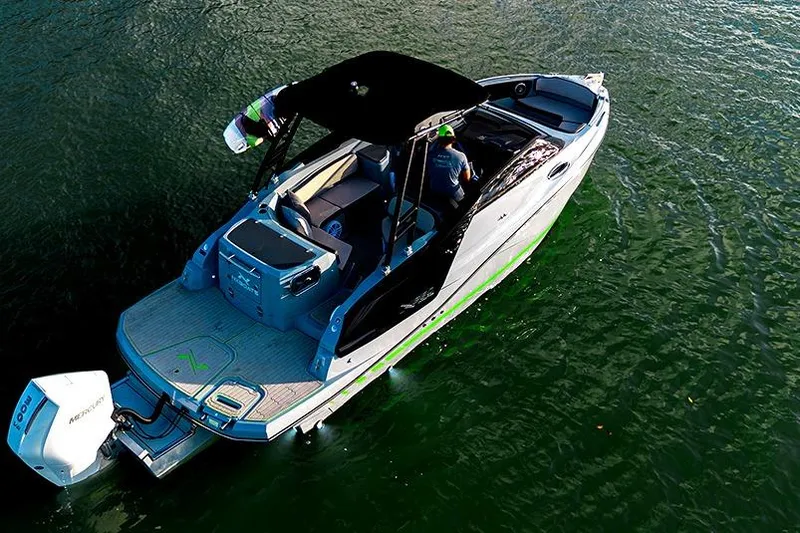 Slide: The Image of 2025 NX Boats NX260 cruising on water, featuring sleek design and modern amenities. - 13