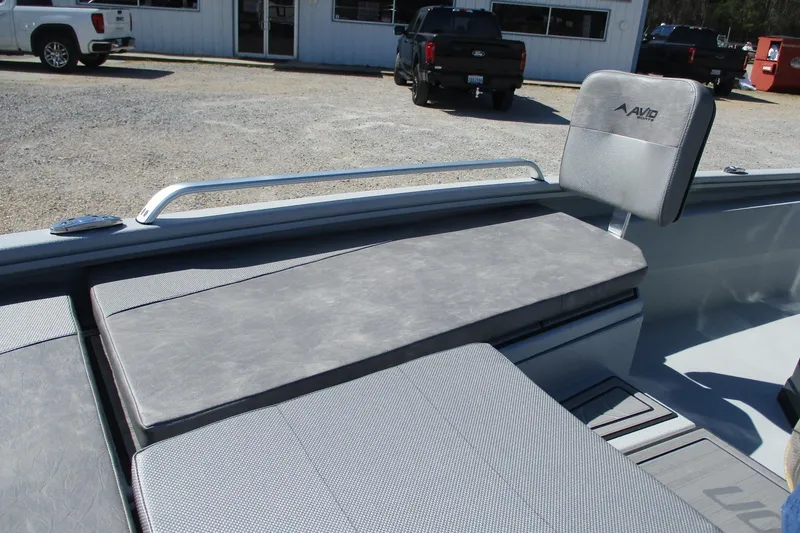 Slide: The Image of 2026 Avid 23 Fusion boat interior with gray seating and backrest. - 11