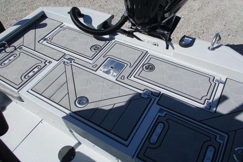 Slide: The Image of Avid 23 Fusion 2026 boat deck with storage compartments and sleek design. - 12