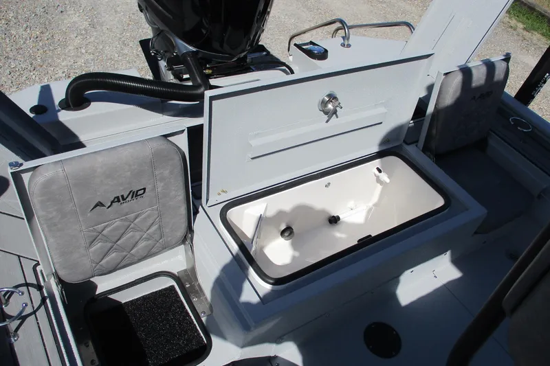 Slide: The Image of 2026 Avid 23 Fusion boat interior with storage compartment and seating. - 13