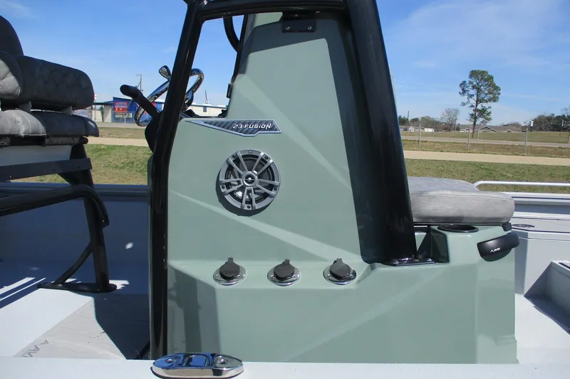 Slide: The Image of Avid 23 Fusion 2026 boat console with speaker and controls, outdoor setting. - 15