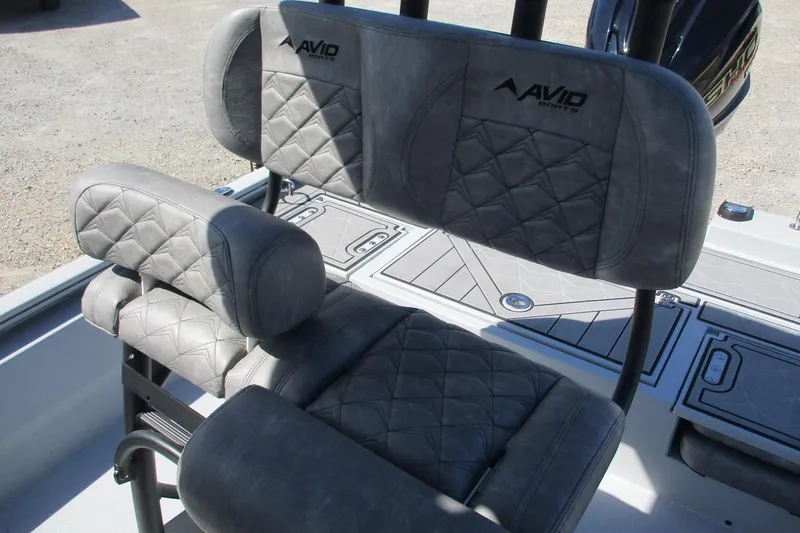 Slide: The Image of Avid 23 Fusion 2026 boat seats with quilted gray upholstery. - 22