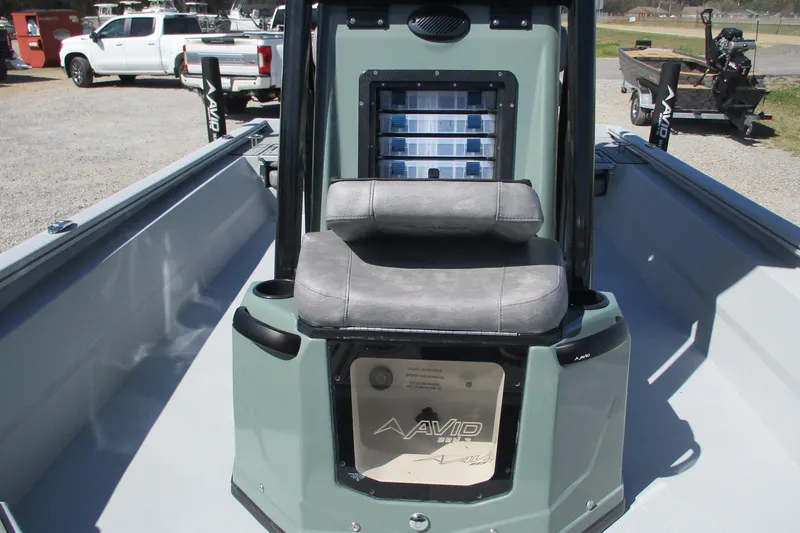 Slide: The Image of 2026 Avid 23 Fusion boat interior with seating and storage compartments. - 25