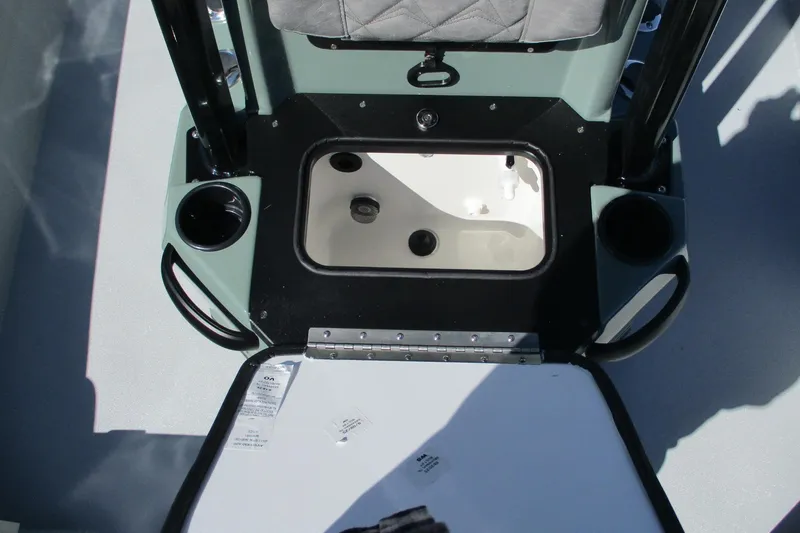Slide: The Image of Interior view of 2026 Avid 23 Fusion boat with storage compartment open. - 26