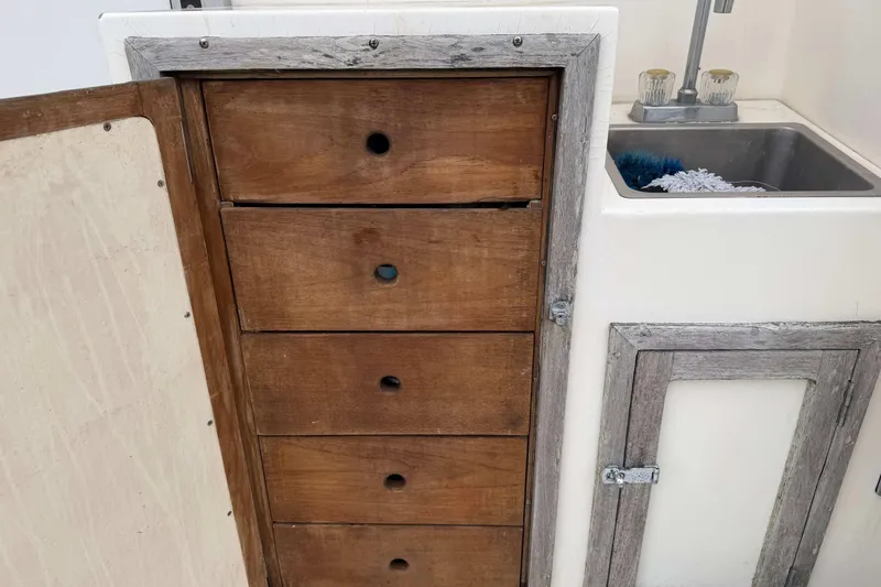 Slide: The Image of Wooden drawers and sink in 1986 Henriques Yachts 35 Maine Coaster interior. - 12