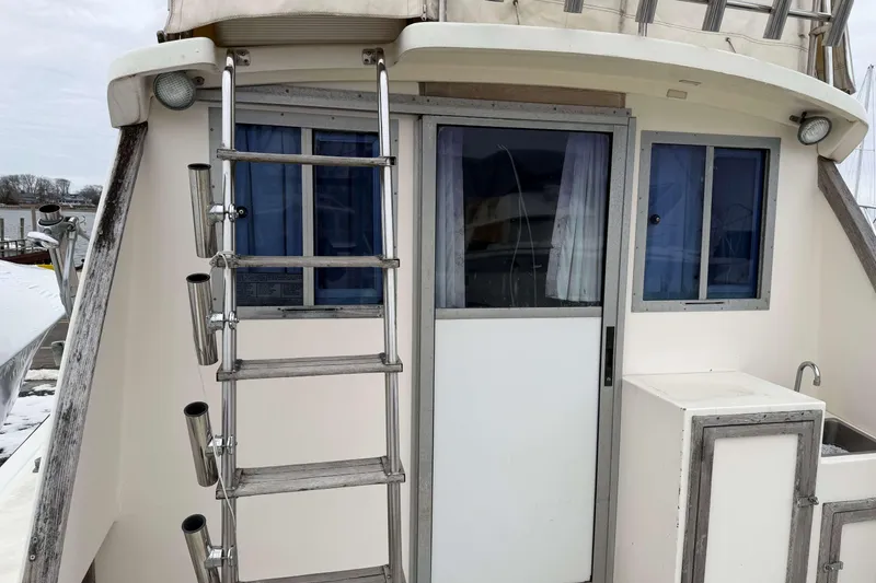 Slide: The Image of 1986 Henriques Yachts 35 Maine Coaster, rear view with ladder and windows. - 13