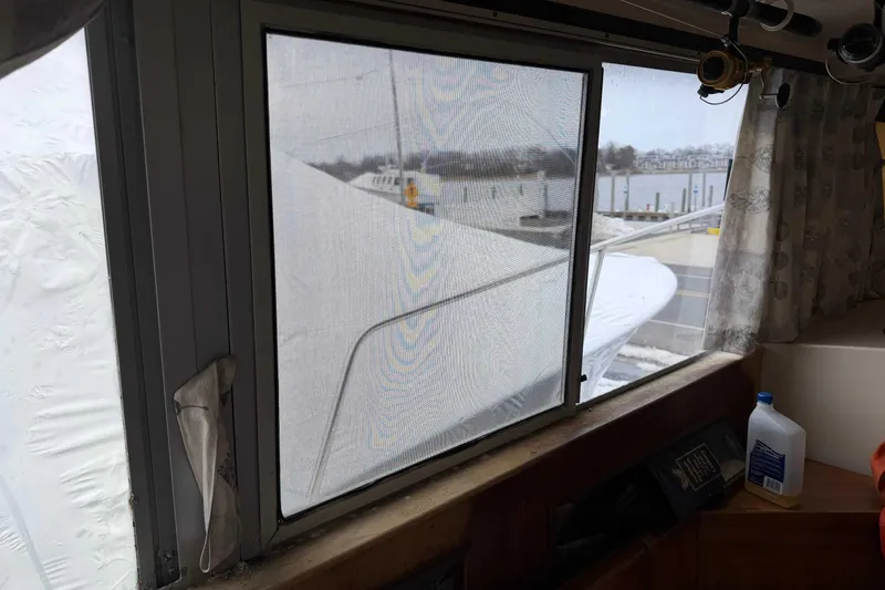 Slide: The Image of View from inside a 1986 Henriques Yachts 35 Maine Coaster, showing marina and dock. - 21