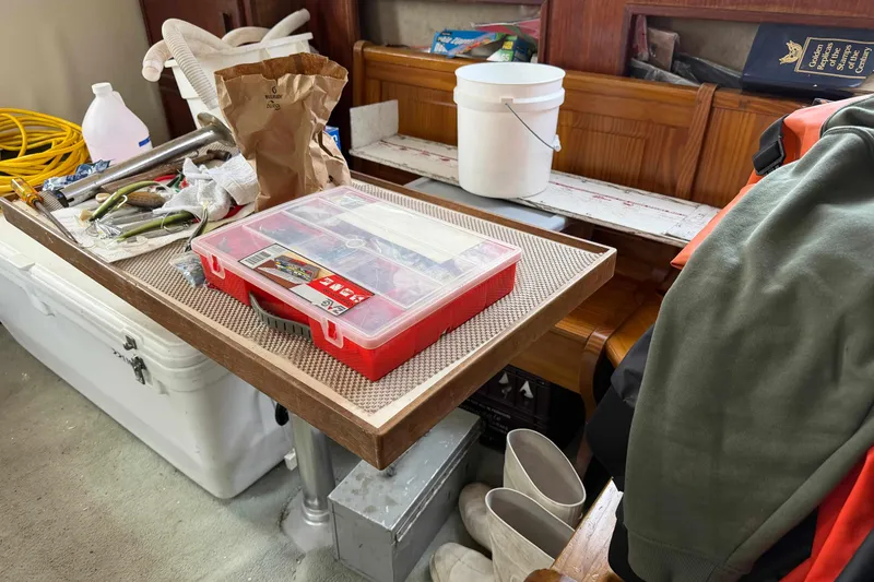 Slide: The Image of Interior of 1986 Henriques Yachts 35 Maine Coaster with tools and supplies on table. - 22