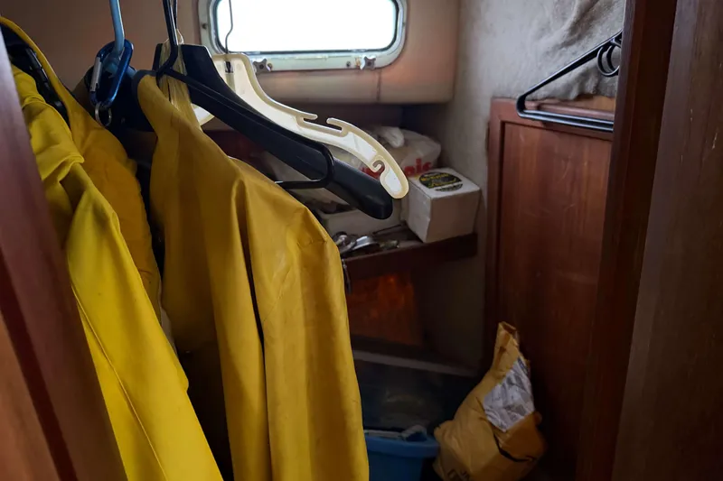Slide: The Image of Yellow raincoats hanging inside 1986 Henriques Yachts 35 Maine Coaster cabin. - 29