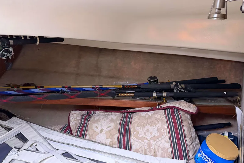 Slide: The Image of Fishing rods and gear stored inside a 1986 Henriques Yachts 35 Maine Coaster. - 32
