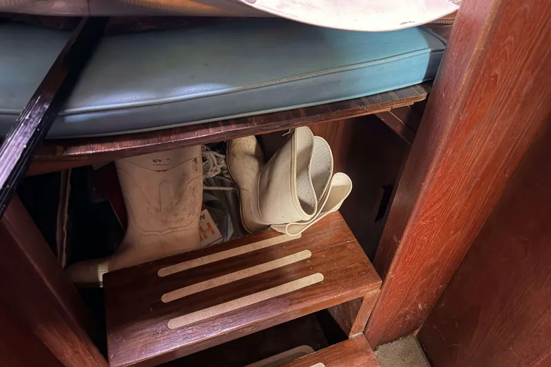 Slide: The Image of Interior of 1986 Henriques Yachts 35 Maine Coaster with boots and wooden steps. - 35