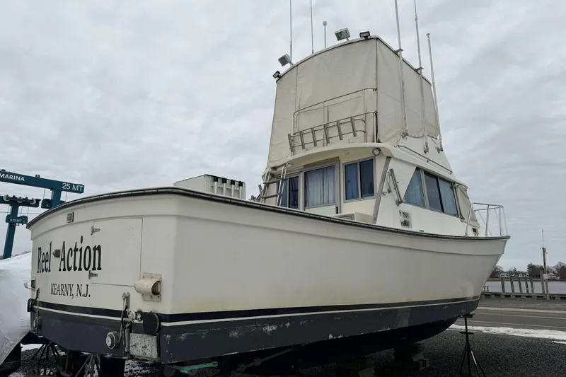 Slide: The Image of 1986 Henriques Yachts 35 Maine Coaster, docked, with "Reel Action" text, Kearny, N.J. - 38