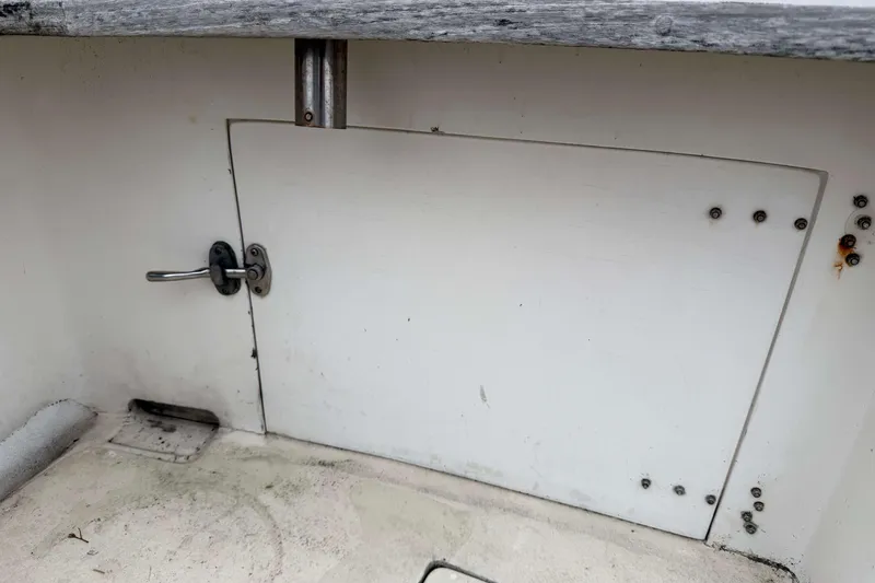 Slide: The Image of Access hatch on 1986 Henriques Yachts 35 Maine Coaster, showing latch and weathered surface. - 7