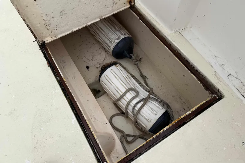 Slide: The Image of Storage compartment with boat fenders on 1986 Henriques Yachts 35 Maine Coaster. - 8