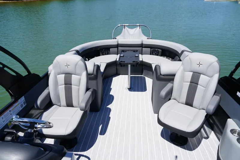Slide: The Image of Luxurious interior of 2026 Berkshire 24 RFX CTS pontoon boat on water. - 14