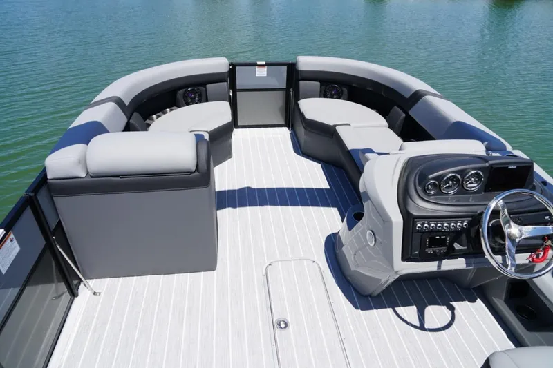 Slide: The Image of 2026 Berkshire 24 RFX CTS pontoon boat interior with modern seating and steering console. - 5