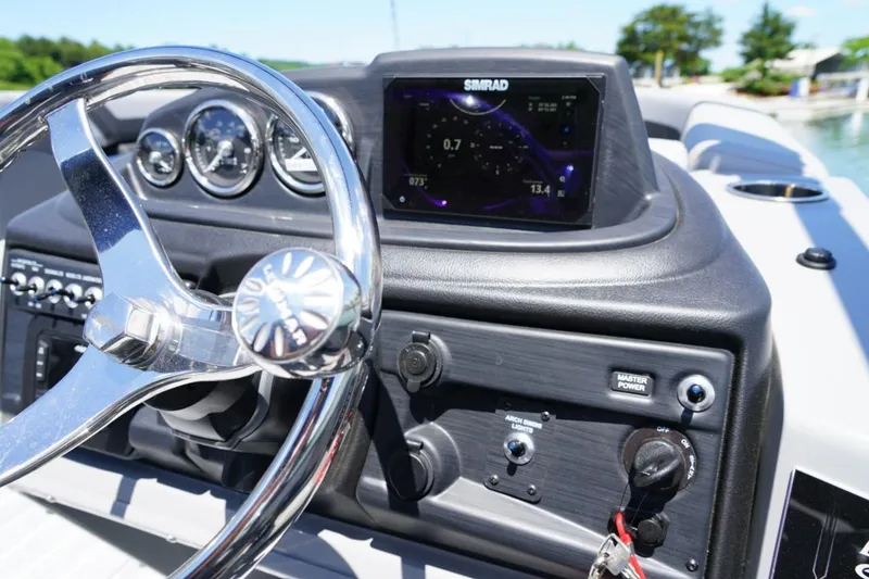 Slide: The Image of Steering console of 2026 Berkshire 24 RFX CTS boat with Simrad display. - 9