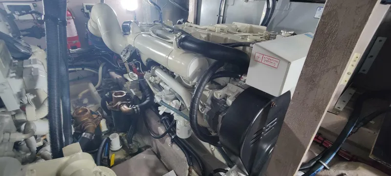 Slide: The Image of Engine room of 2003 Sea Ray 390 Motor Yacht, showcasing mechanical components and systems. - 13