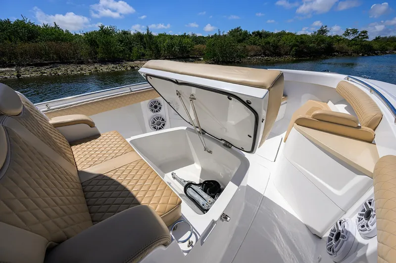 Slide: The Image of Luxurious 2024 HCB 39 Speciale boat interior with tan seating and storage compartment. - 14