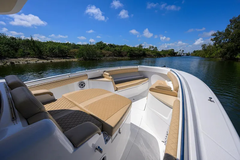 Slide: The Image of 2024 HCB 39 Speciale boat interior with luxurious seating on a sunny day. - 15
