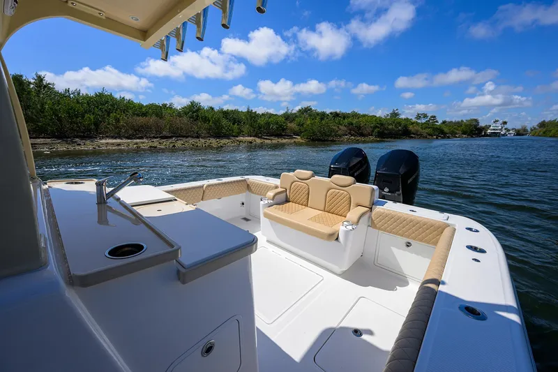 Slide: The Image of 2024 HCB 39 Speciale boat interior with seating, water view, and blue sky. - 16