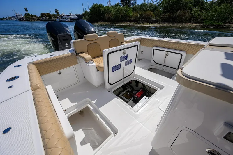 Slide: The Image of 2024 HCB 39 Speciale boat interior with open storage compartments and dual engines. - 24