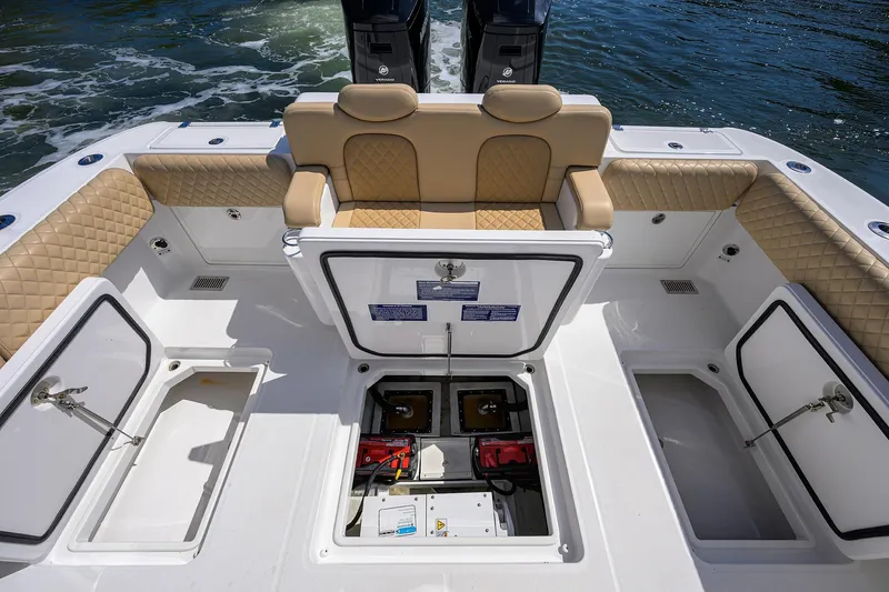 Slide: The Image of 2024 HCB 39 Speciale boat interior with storage compartments and cushioned seating. - 25