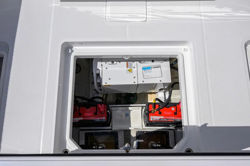 Slide: The Image of 2024 HCB 39 Speciale boat battery compartment with red batteries and electrical components. - 27