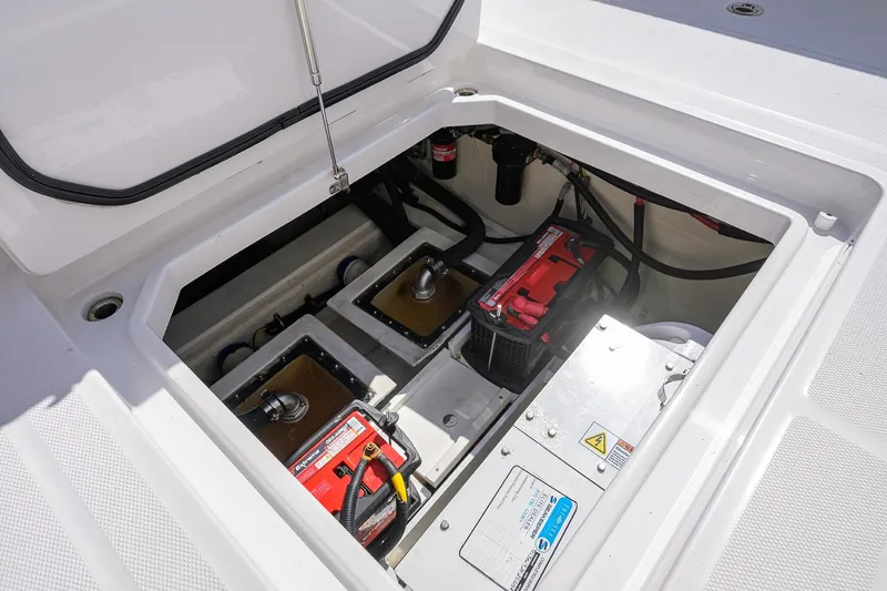 Slide: The Image of 2024 HCB 39 Speciale boat battery compartment with wiring and components. - 28