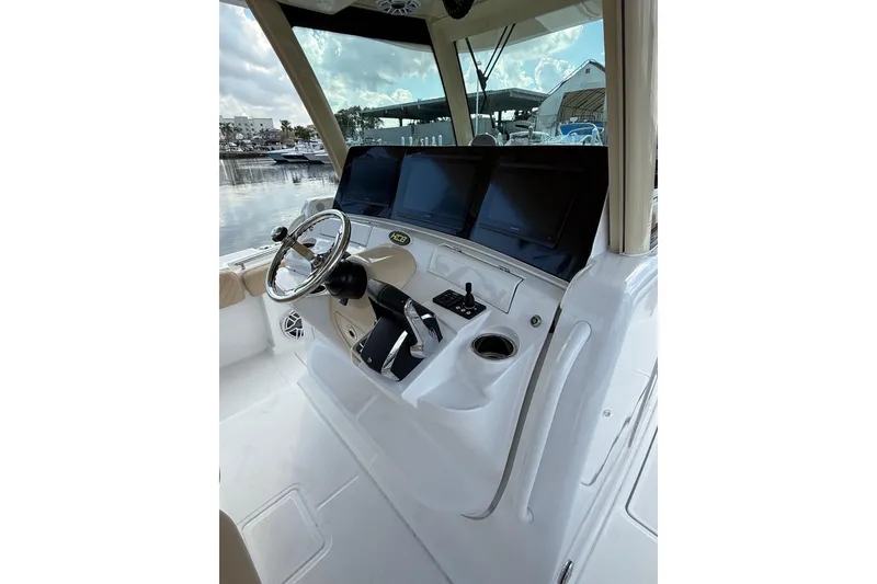 Slide: The Image of 2024 HCB 39 Speciale boat helm with modern controls and navigation screens. - 3