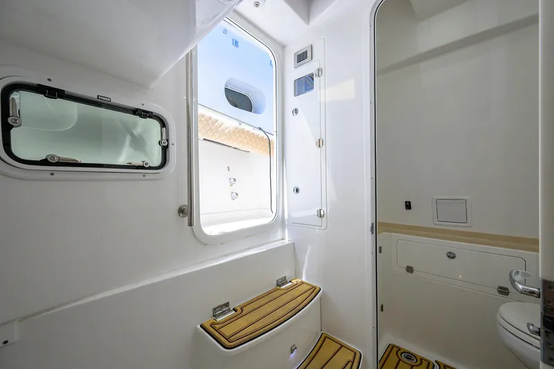 Slide: The Image of 2024 HCB 39 Speciale boat interior with modern bathroom design and wooden accents. - 34