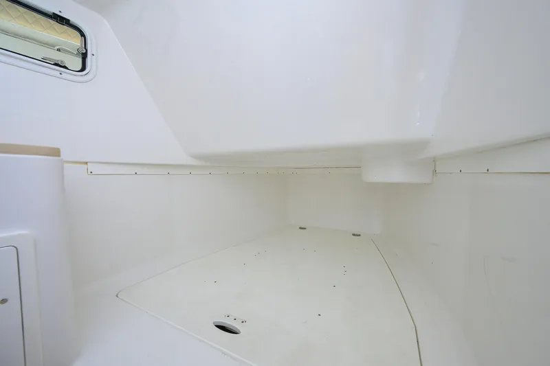 Slide: The Image of Interior cabin space of 2024 HCB 39 Speciale boat, featuring sleek white design. - 37