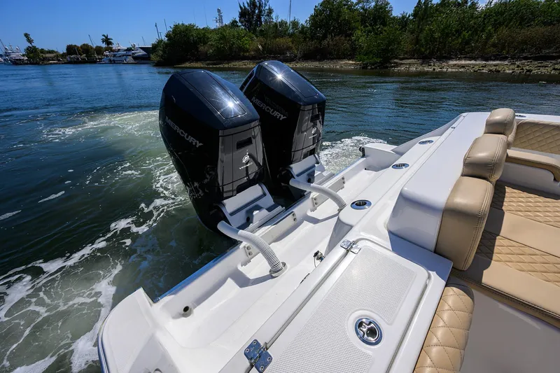 Slide: The Image of 2024 HCB 39 Speciale boat with dual Mercury outboard engines on water. - 39