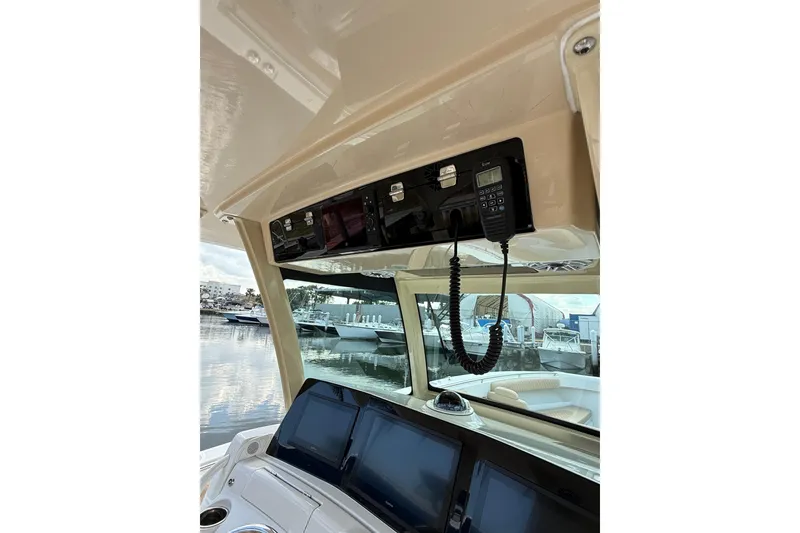 Slide: The Image of 2024 HCB 39 Speciale boat interior with navigation equipment and waterfront view. - 4